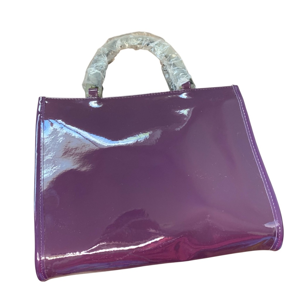 Neiman Marcus NWOT purple eggplant patent with grey marbled leucite handles.